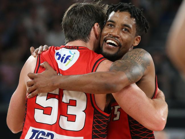 Damian Martin and Bryce Cotton celebrate after winning the NBL championship.