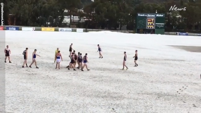 Hail blankets Melbourne footy field