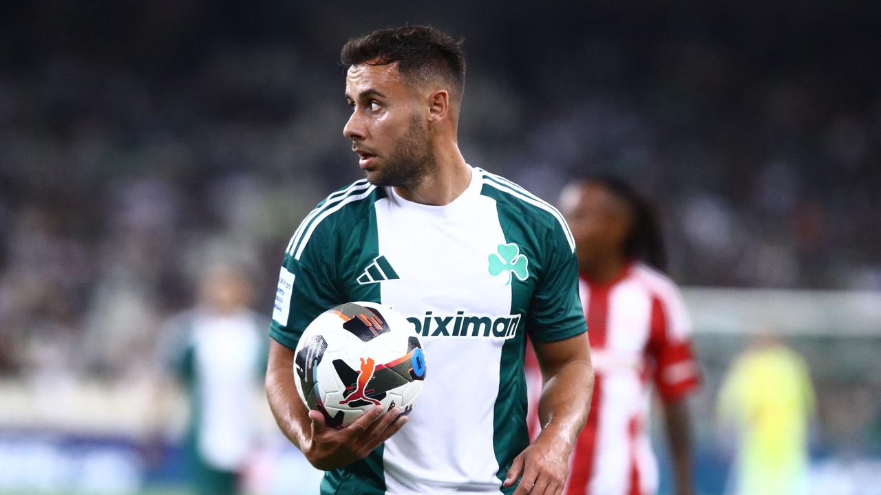 Greece defender George Baldock holding the ball during the Super League Greece football match against Olympiacos in Athens. (Photo by Eurokinissi / AFP)