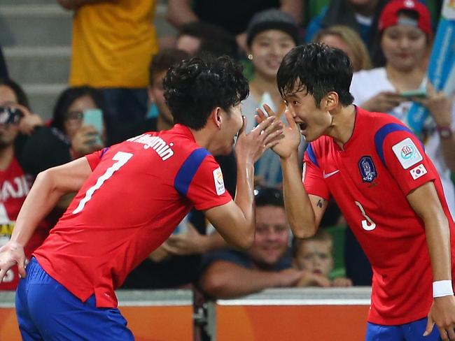 MELBOURNE, AUSTRALIA - JANUARY 22: Son Heung Min of Korea Republic celebrates with Kim Jin Su after he scored in extra time during the 2015 Asian Cup match between Korea Republic and Uzbekistan at AAMI Park on January 22, 2015 in Melbourne, Australia. (Photo by Robert Cianflone/Getty Images)