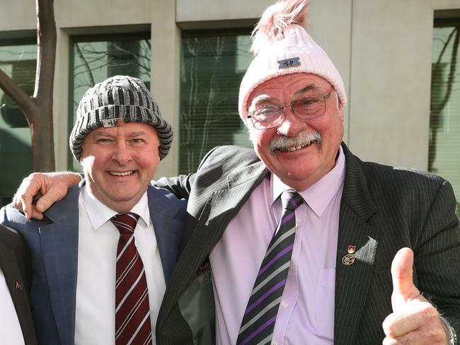 Greg Hunt, Anthony Albanese and Warren Entsch showing their support for the Mark Hughes Foundation and the Beanie for Brain Cancer campaign by putting on a beanie  at Parliament House in Canberra. Picture Kym Smith