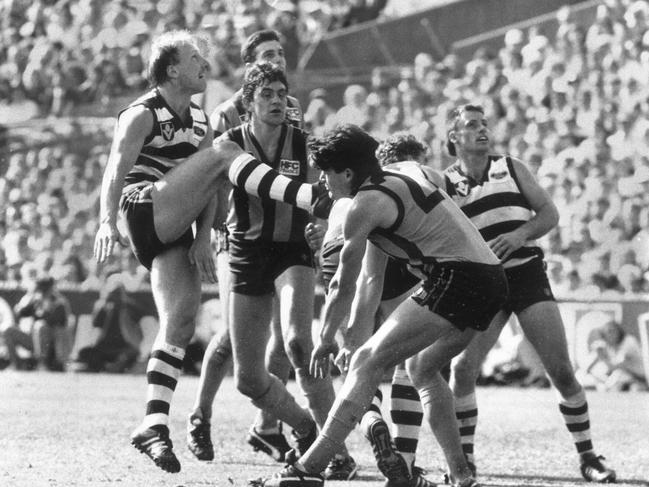 Gary Ablett plucks the ball in a ruck contest, and, in the same movement, kicks it around his body for a goal in the 1989 Grand Final.