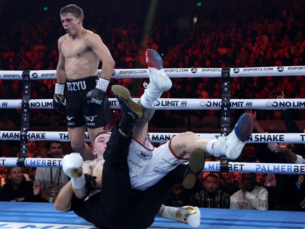 Tszyu reacts as Ben Bommber and the referee take a tumble in Nikita’s first round win in Melbourne in May. Picture: Robert Cianflone/Getty Images