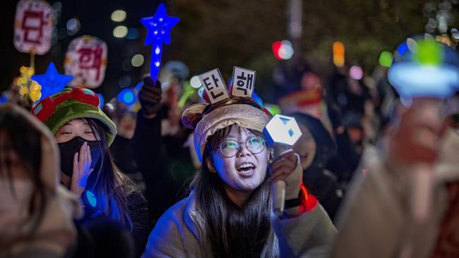 Protesters rally against the president outside the National Assembly in Seoul. Picture: Getty Images.