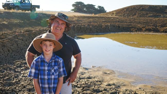 Lewis Walter, 9, with dad Rob Walter at one of their Strathkellar farm dams, which is fenced. Picture: Rachel Simmonds