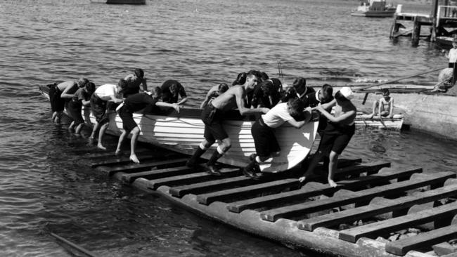 The 1st Derwent Sea Scouts bringing a boat into their headquarters at the Domain slipyards in 1946.