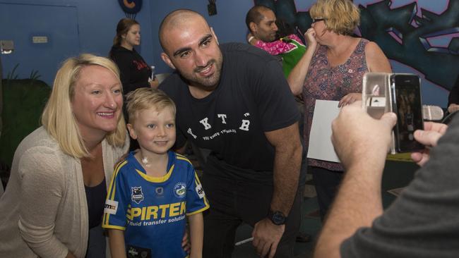 Parramatta skipper Tim Mannah makes on little boy’s day.