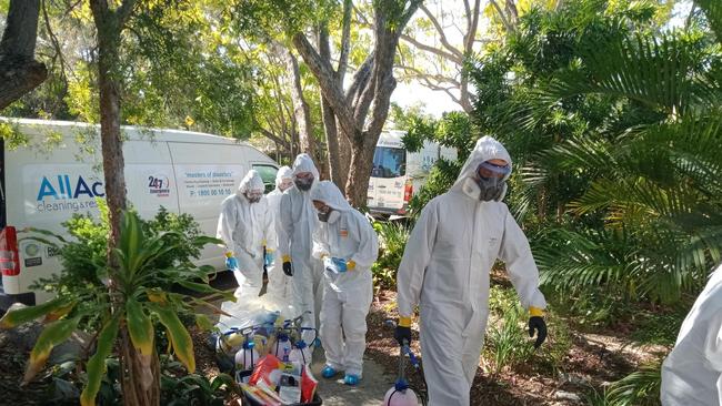 A Covid-19 cleaning crew at Indooroopilly State High School after a student tested positive. Picture: Grace Grace/Facebook