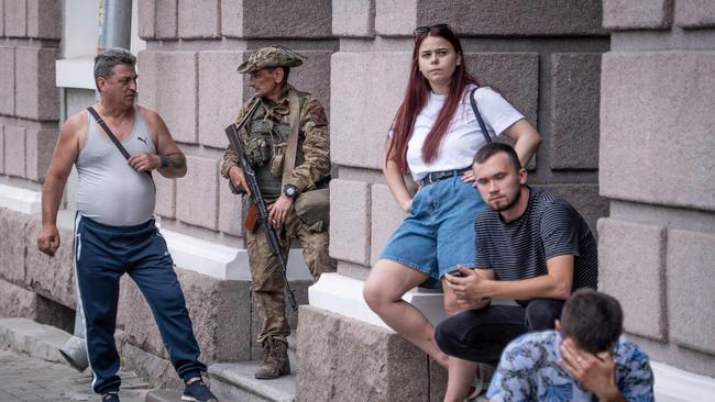 A member of Wagner group speaks with a local resident in Rostov-on-Don. Picture: AFP