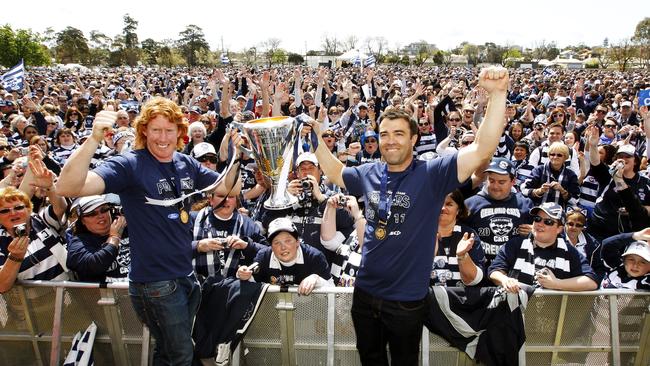 Cameron Ling and Chris Scott celebrate Cats’ 2011 premiership, their third in five years. The Cats have bowed out in a preliminary final four times since then.