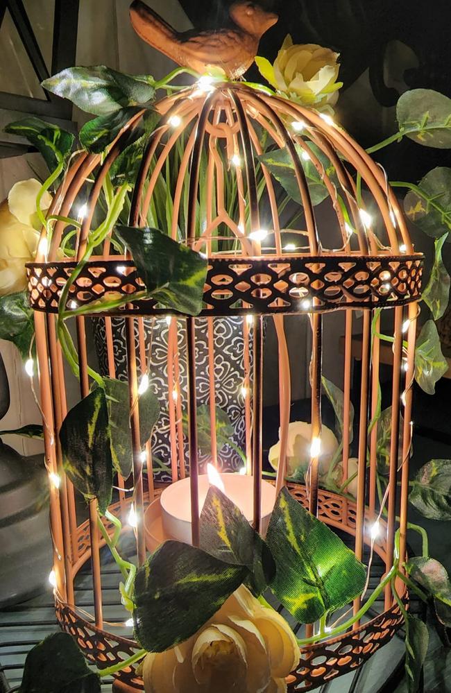 Stephanie Burgess transformed an old vintage lamp frame into an elegant light source, part of her design and upcycling skills. Picture: Facebook