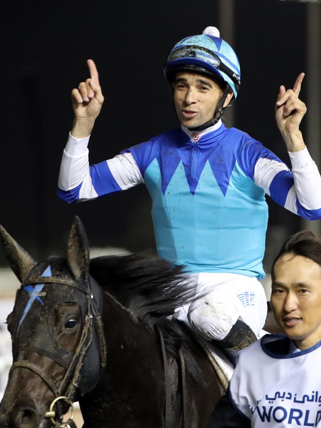 Jockey João Moreira celebrates after leading Vivlos to win at the Dubai World Cup. Picture: AFP Photo/Karim Sahib