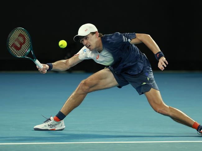 MELBOURNE, AUSTRALIA - JANUARY 20: Alex de Minaur of Australia plays a forehand against Alex Michelsen of the United States in the Men's Singles Fourth Round match during day nine of the 2025 Australian Open at Melbourne Park on January 20, 2025 in Melbourne, Australia. (Photo by Darrian Traynor/Getty Images)