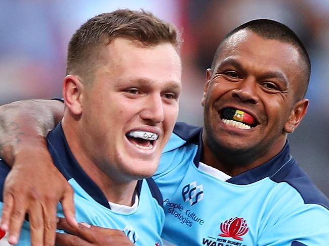 SYDNEY, AUSTRALIA - FEBRUARY 28: Angus Bell and Kurtley Beale of the Waratahs celebrate Bell scoring a try during the round five Super Rugby match between the Waratahs and the Lions at Bankwest Stadium on February 28, 2020 in Sydney, Australia. (Photo by Mark Kolbe/Getty Images)