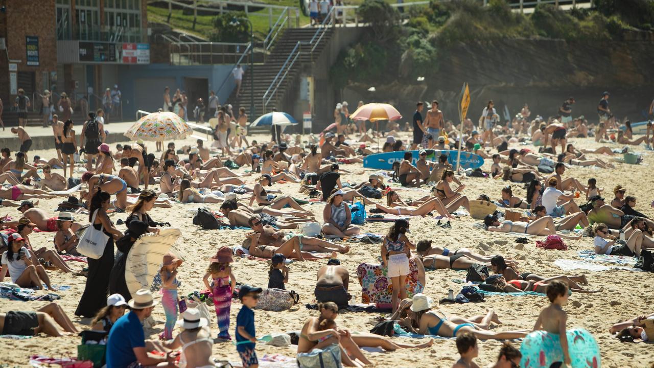 Police finally arrive at a packed Bronte Beach on September 11 as one person described the beach as being "As busy as Australia Day". Pictures by Julian Andrews