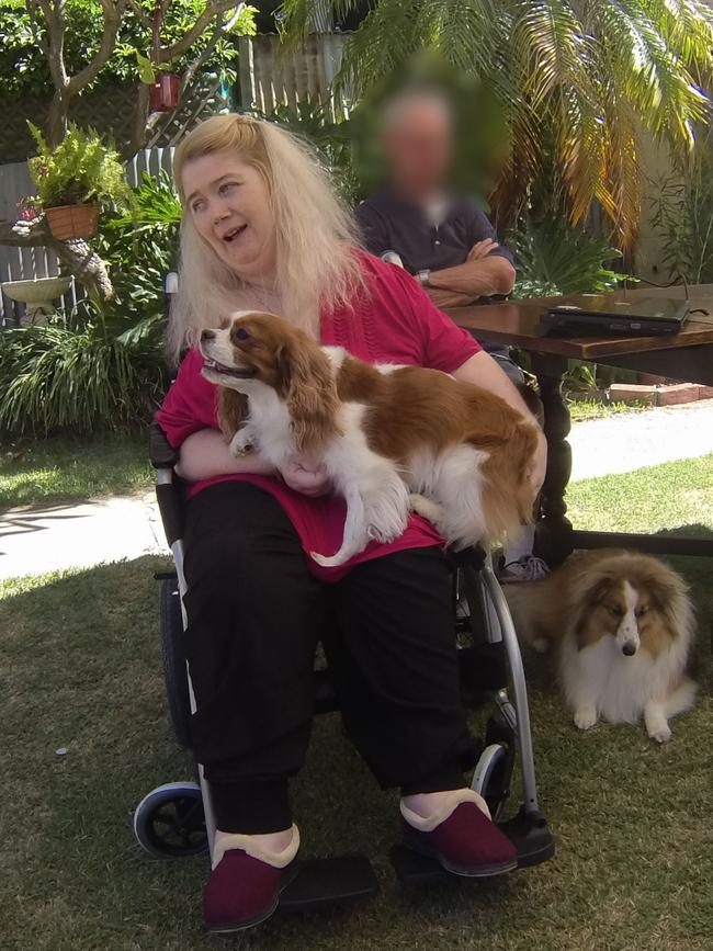 Ann Marie Smith happy at a social occasion in December 2011, holding her beloved dog Deana, with Maggie beside her. Picture: SAPOL