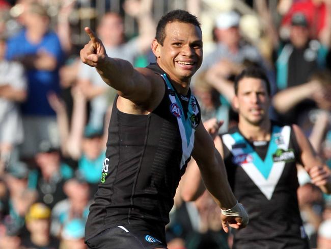 AFL Football - Port Adelaide Power vs Melbourne, first AFL match at Adelaide Oval - footballer Daniel Motlop celebrates a goal.