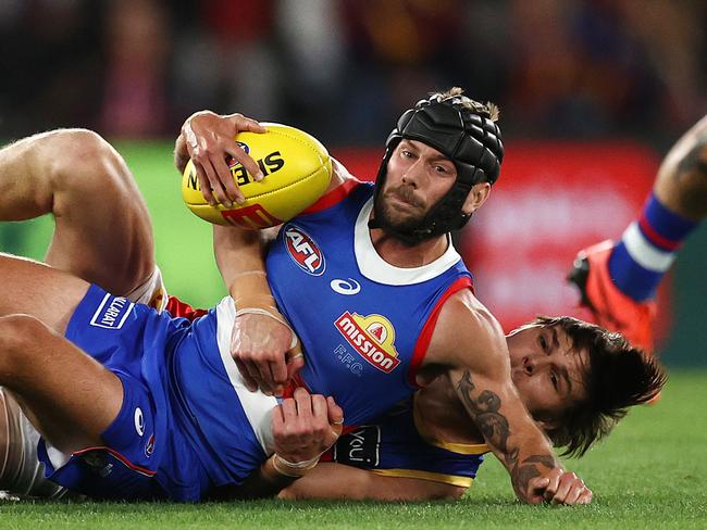 Caleb Daniel is tackled by Eric Hipwood. Pic: Michael Klein