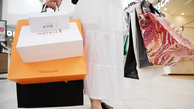 Tirana Reid poses with a haul from Casuarina Square ahead of Boxing Day sales. Picture: (A)manda Parkinson