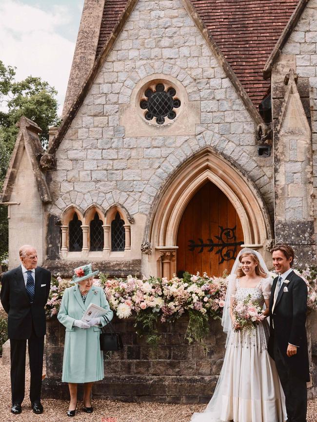 Britain's Princess Beatrice of York (2R), her husband Edoardo Mapelli Mozzi (R), pose with Britain's Queen Elizabeth II (2L) and Britain's Prince Philip, Duke of Edinburgh (L) outside The Royal Chapel of All Saints at Royal Lodge, Windsor.