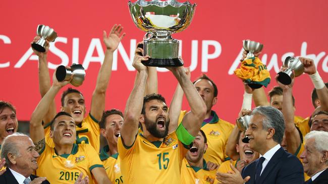 Mile Jedinak lifts the trophy at the Asian Cup final. Picture: Getty Images