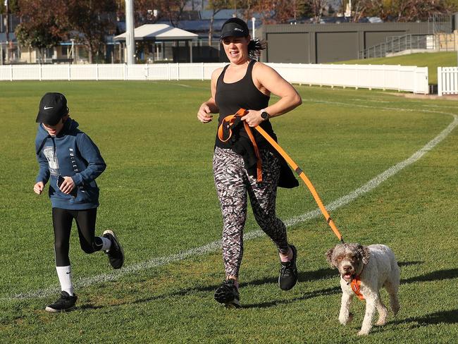 A woman and child exercising at Unley Oval on Wednesday. Picture: Sarah Reed