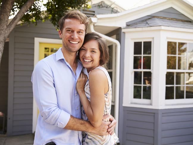 A couple who have just signed up a mortgage after buying their first house. Generic first home buyers Picture: iStock.