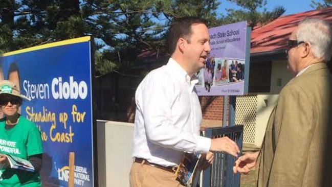 Moncrieff MP Steve Ciobo talking to voters outside the Broadbeach State School.