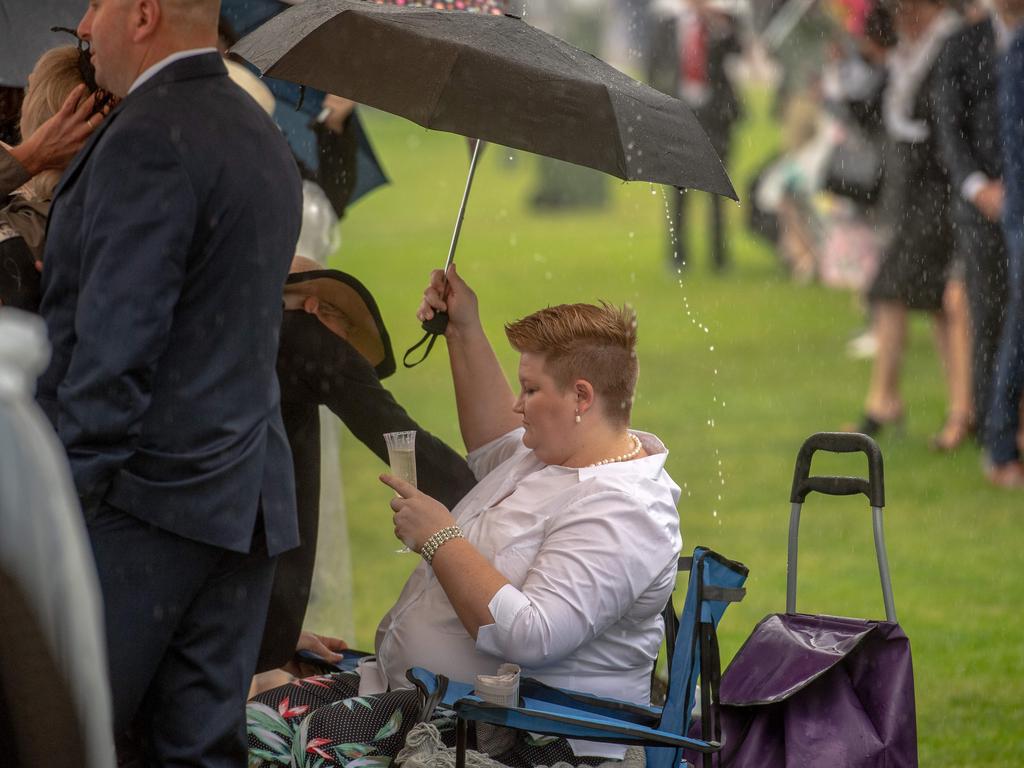 The race that stops the nation sure did park a few punters under their umbrellas for most of the day. Picture: Jason Edwards