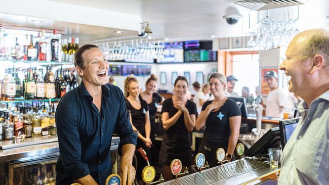 New owner of the Harbord Hotel, Glenn Piper pours his first beer for former pub manager Sean King earlier this year. Picture: Supplied.