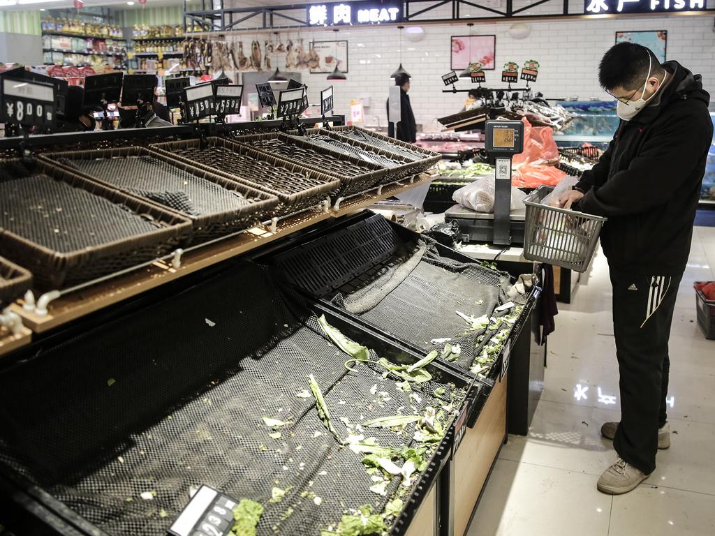 Supermarket shelves in Wuhan are bare as residents scramble to stockpile on goods. Picture: Getty Images