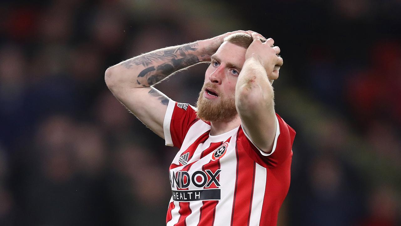 SHEFFIELD, ENGLAND – FEBRUARY 15: Oliver McBurnie of Sheffield United reacts after a missed chance during the Sky Bet Championship match between Sheffield United and Hull City at Bramall Lane on February 15, 2022 in Sheffield, England. (Photo by George Wood/Getty Images)
