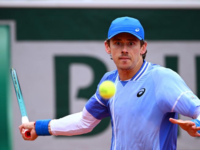 PARIS, FRANCE - MAY 28: Alex De Minaur of Australia plays a forehand against Alex Michelsen of United States in the Men's Singles first round match on Day Three of the 2024 French Open at Roland Garros on May 28, 2024 in Paris, France. (Photo by Clive Mason/Getty Images)