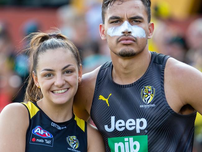 Richmond training at the Punt road Oval. The girls and the men training together in front of the fans.Monique Conti sits behind her boyfriend Sydney Stack in the team shot.Picture Jay Town