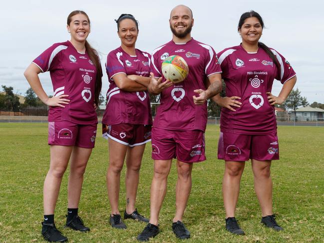 Wellington Cowboys players Keelie Blackhall, 20, Fallon Ah See, 36, and Monique Peachey, 23, with first grade player and coach Aidan Ryan. Picture: David Swift