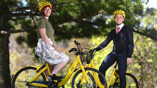 Bike riders Jess Miller and Patrick Lang on ofo bikes. Pic: Tait Schmaal