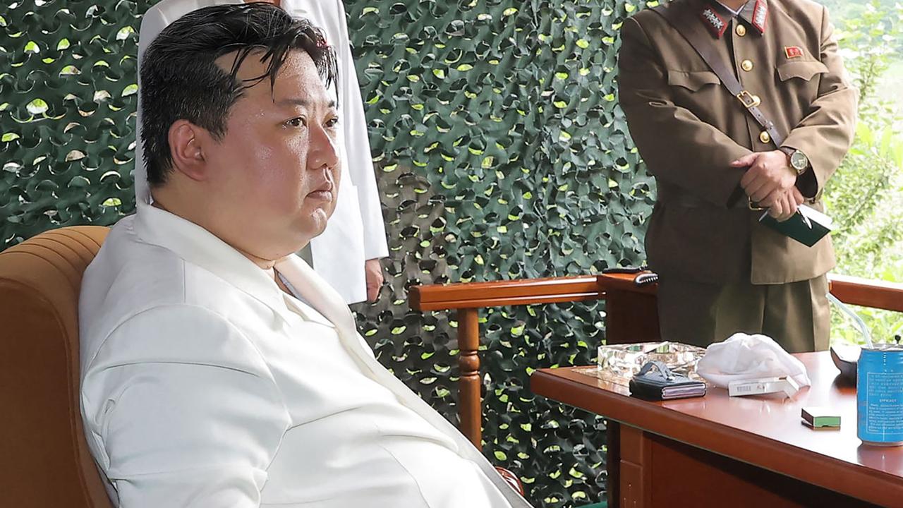 This picture taken on July 12, 2023 and released from North Korea's official Korean Central News Agency (KCNA) on July 13, 2023 shows North Korea's leader Kim Jong Un (front L) attending the test firing of a new intercontinental ballistic missile (ICBM) "Hwasong-18" at an undisclosed location in North Korea. North Korea said on July 13 it had successfully tested its new intercontinental ballistic missile, state media reported, as Pyongyang vented its fury after threatening to down US spy planes it said had violated its airspace. (Photo by KCNA VIA KNS / AFP) / South Korea OUT / ---EDITORS NOTE--- RESTRICTED TO EDITORIAL USE - MANDATORY CREDIT "AFP PHOTO/KCNA VIA KNS" - NO MARKETING NO ADVERTISING CAMPAIGNS - DISTRIBUTED AS A SERVICE TO CLIENTS / THIS PICTURE WAS MADE AVAILABLE BY A THIRD PARTY. AFP CAN NOT INDEPENDENTLY VERIFY THE AUTHENTICITY, LOCATION, DATE AND CONTENT OF THIS IMAGE --- /