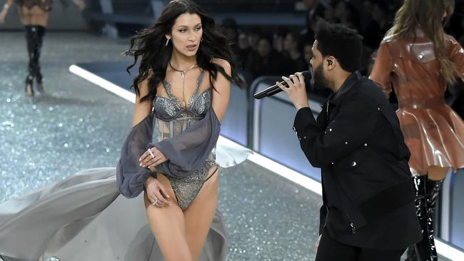 Bella Hadid and The Weeknd on stage during the 2016 Victoria's Secret Fashion Show in Paris. Picture: Kristy Sparow, WireImage.