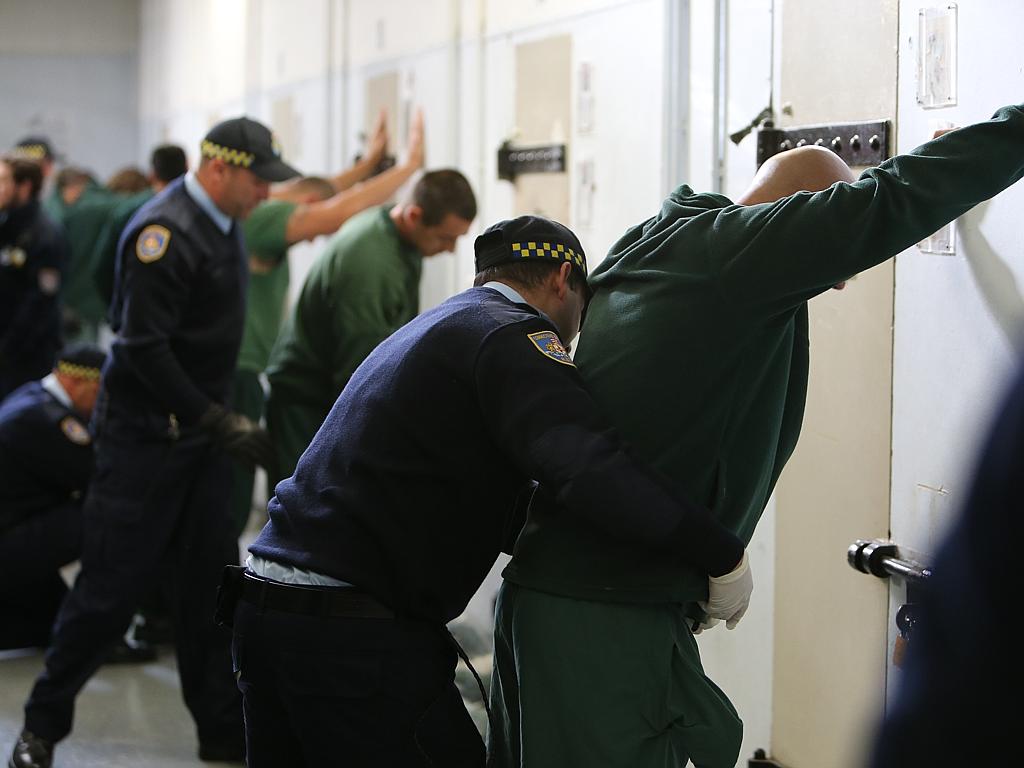 The trainees learn how to conduct thorough searches of inmates. Picture: Tim Hunter