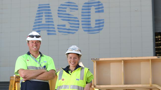 Jubilant ASC workers Simon Ats and Debbie Spence this morning. Picture: Tait Schmaal