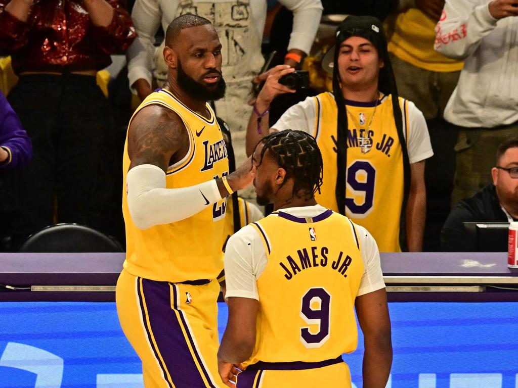 Lakers stars LeBron and Bronny James take the court together against the Timberwolves, becoming the first father-son duo to play an offical NBA game together. Picture: AFP