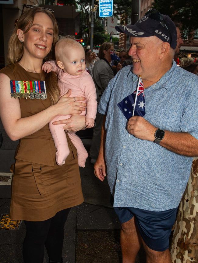 Thousands of people have braved the rain to gather in Brisbane for Anzac Day services. Picture: Grace Kessels