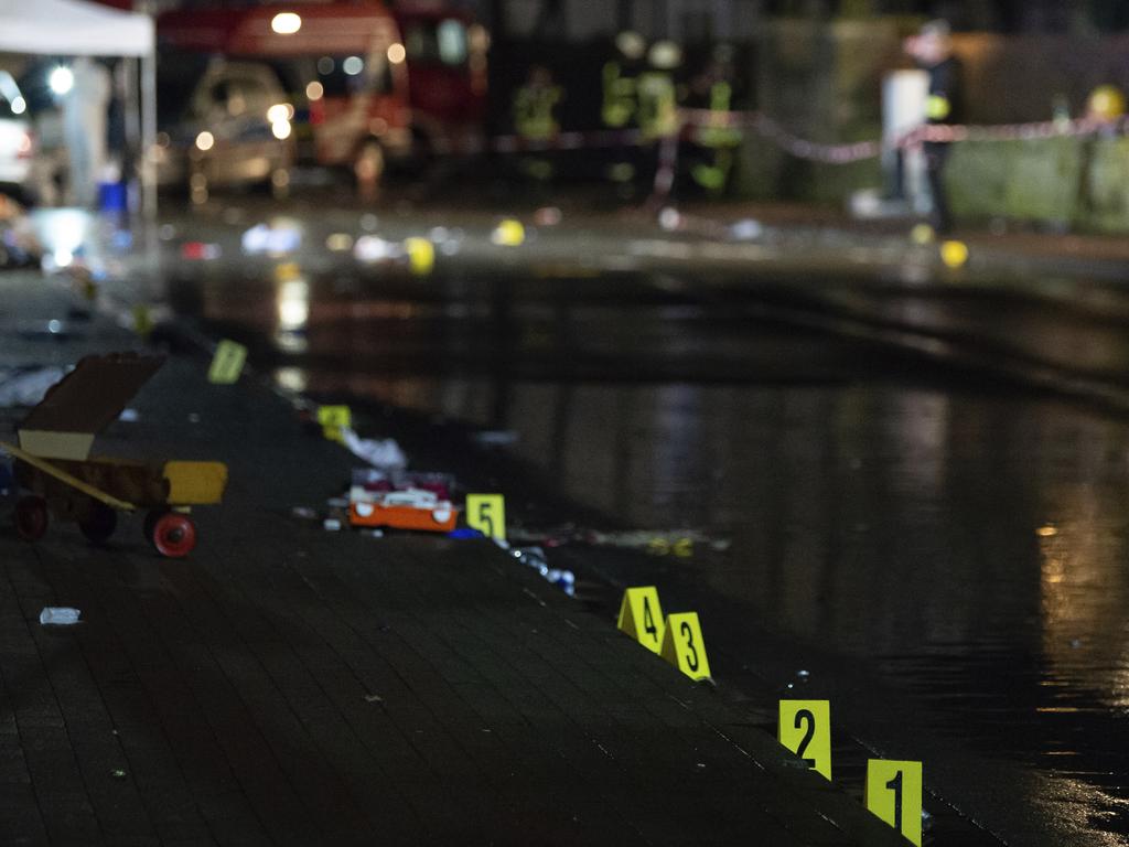 Investigators' markings where the car hit the crowd. Picture: dpa via AP