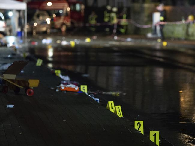 Investigators' markings where the car hit the crowd. Picture: dpa via AP