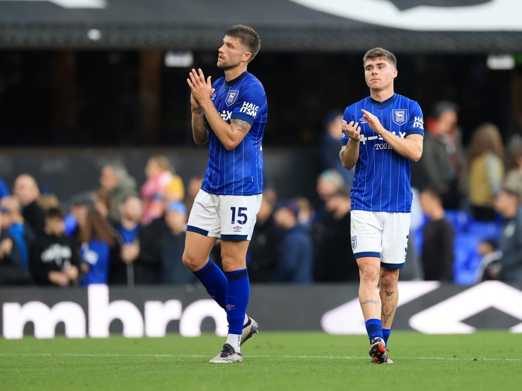 Cameron Burgess (left) and his Ipswich teammate Leif Davis thank fans for their support after a 2-0 loss to Everton. Picture: Stephen Pond/Getty Images