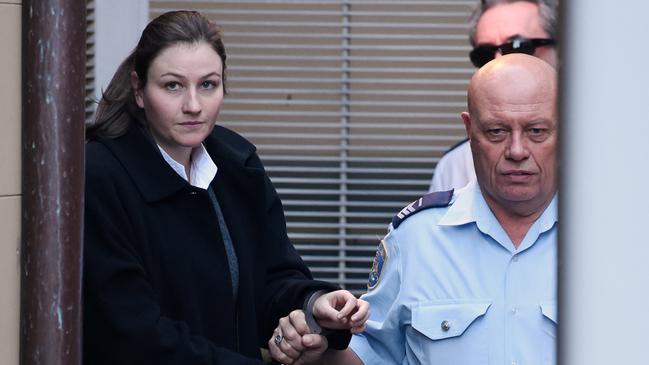 Harriet Wran is escorted to a prison transport vehicle at the NSW Supreme Court in 2016. Picture: AAP