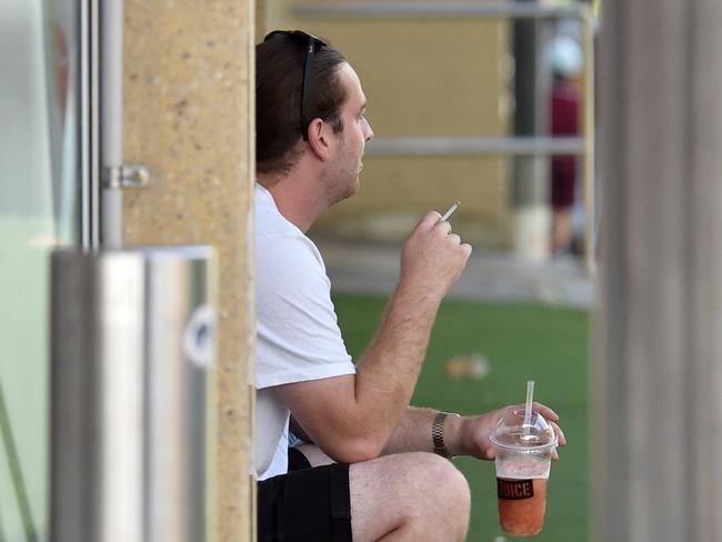 Smokers in Hornsby Mall. It's illegal to smoke in the mall but people do anyway and council is fed up. Picture: Troy Snook
