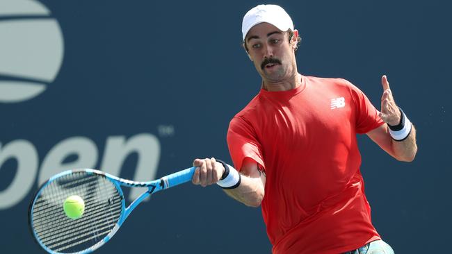 Jordan Thompson of Australia returns a shot against Joao Sousa of Portugal during their Men's Singles first round match on day two of the 2019 US Open.