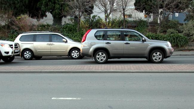 Road line markings around Hobart city. Lines are barely visible in some patches on the Brooker Highway near the intersection of Macquarie Street.