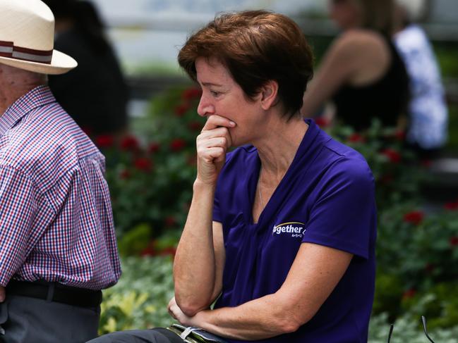 Members of the public watch the Queensland Police Memorial Service for Constable Rachel McCrow and Constable Matthew Arnold from King George Square. Picture: Zak Simmonds